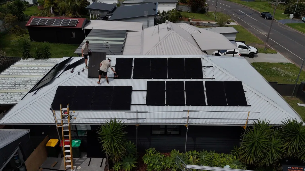 Elite Energy Co. team installing solar panels on a roof